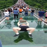 People are making AI videos of obese people doing crazy things  And these videos go EXTREMELY viral on social media  Here I collected TOP 7 recent examples:  1/ Grandma collapsing a glass bridge (almost 100M views in 24 hours on IG)