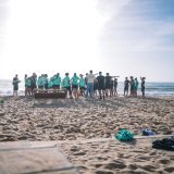 Photo shared by Alex Popp on January 15, 2024 tagging @vfl.wolfsburg.frauen. May be an image of 19 people, wetsuit, beach, ocean, crowd and water.