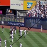 Fans at Yankee Stadium throw things at Guardians players after the game ends.