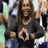 Serena Williams beat Montenegro's Danka Kovinic (6-3, 6-3) in the US Open's first-round on Monday night  Curiously, Bill Clinton was seen seated next to sex therapist and talk show host, Dr. Ruth&nbsp;Westheimer  People hold up signs reading "We love