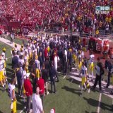 Michigan RB coach Mike Hart went down on the sideline after the Indiana TD, and was carted off the field.