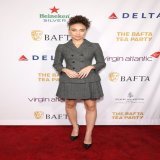 Attending the @BAFTA Tea Party, Bailey Bass wore a grey double-breasted #DiorBarJacket and pleated skirt with lace trim, while Danielle Deadwyler opted for a #DiorSS23 black blouse and skirt with multicolor floral embroidery by Maria Grazia Chiuri. #