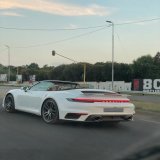 Grandparents and their 2 grandchildren in a 911 Turbo S