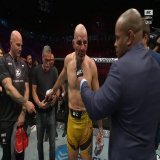 Glover Teixeira placed his gloves in the center of the Octagon after an epic battle at #UFC283
