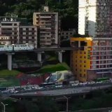 A train that runs through residential apartments in China.