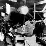 Frank Capra gets ready to shoot the next scene in 1934's "It Happened One Night" while Claudette Colbert and Clark Gable wait in the wings. After she finished filming, Colbert said to her friends "I just finished the worst picture in the world.&rdquo