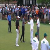 Scottie Scheffler, Ted Scott, and Phil Mickelson greet each other on the practice green.  #TheMasters