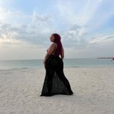 Photo by B R I \ud83e\udd8b on November 18, 2023. May be an image of fishnet stockings, gown and sarong.