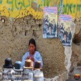 A lady selling bowler hats in a street market in La Paz #Bolivia for #NationalHatDay, available as prints cards and #gifts here:  #AYearForArt #BuyIntoArt #GiftThemArt #BuyArtNotCandy #HatDay #hats #markets #LaPaz #traditionaldress #streetphotography
