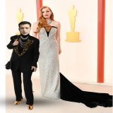 Ambassador to Ukraine, Jessica Chastain with her date for the evening. Note how he came with a purse to collect checks from everyone. He also takes Venmo and CashApp as well as #bitcoin