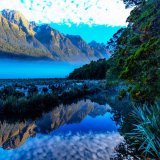Blue mist at Lake Matheson in New Zealand