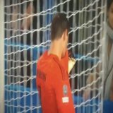 Courtois kissing the Real Madrid badge in front of Chelsea supporters.