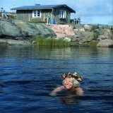 Tove Janssen, author of the Moomin books, swimming outside her summer cottage Klovharun in Pellinge, Finland.