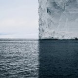 This photo by David Burdeny is still one of the coolest iceberg photos in existence thanks to the perfect composition and symmetry that separates the photo into four different sections of colour and texture   [site:
