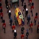 Draped in the Royal Standard, Her Majesty The Queen's coffin is taken in Procession to Westminster Hall.