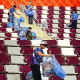 Japan fans clean up following their team's win vs. Germany at the World Cup