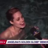 Angelina Jolie jumps into the pool after winning her Golden Globe and pulls a reporter in with her  (1999)