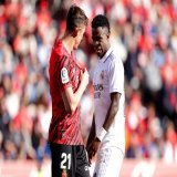 Vini's wincing reaction to Raillo's badge