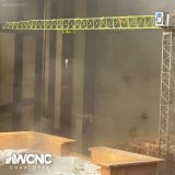 A chilling photo from WCNC viewer Melissa Weber shows a man standing on top of a crane waiting to be rescued as Charlotte firefighters battle a massive 5-alarm fire near SouthPark Mall.   Read more: