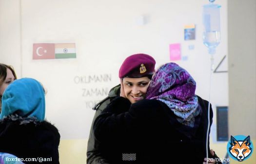 A Turkish woman hugs a woman officer of the Indian Army and gives her a peck, in an earthquake-affected area of Turkey.  Indian Army has deployed disaster relief teams and Army Field Hospital to help the victims of the earthquake.   #TurkeyEarthquake