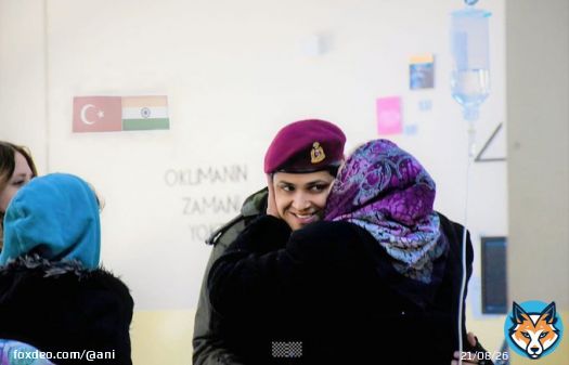 A Turkish woman hugs a woman officer of the Indian Army and gives her a peck, in an earthquake-affected area of Turkey.  Indian Army has deployed disaster relief teams and Army Field Hospital to help the victims of the earthquake.   #TurkeyEarthquake