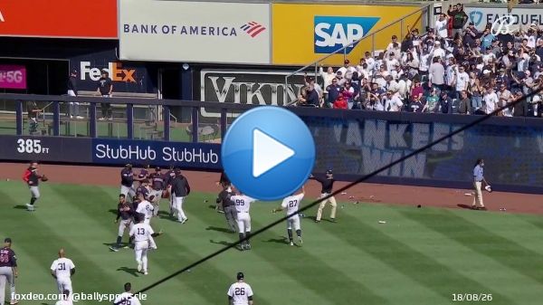 Fans at Yankee Stadium throw things at Guardians players after the game ends.