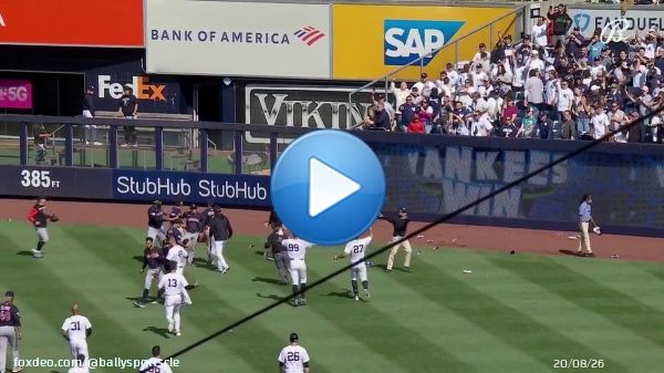 Fans at Yankee Stadium throw things at Guardians players after the game ends.