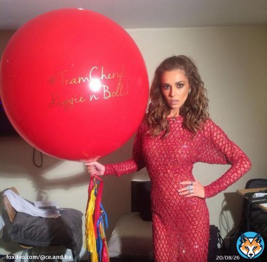 The English singer Cheryl with a personalized big balloon#cheryl #teamcheryl #xfactor #reddress #gala #elegantwoman #red #balloon