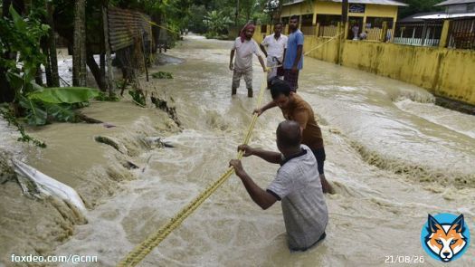 Nearly half a million people in northeast India have been affected by severe flooding after heavy rains battered the region, turning roads into rivers and submerging entire villages