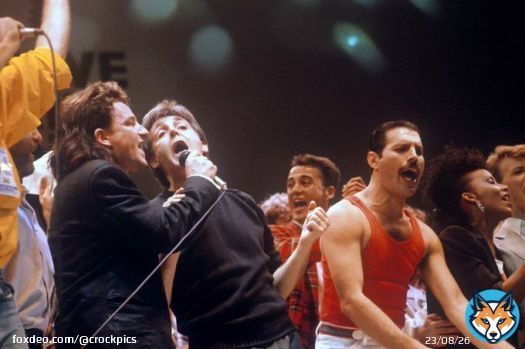 Bono, Paul McCartney, and Freddie Mercury at Live Aid, 1985. Photo by PA Images via Getty Images