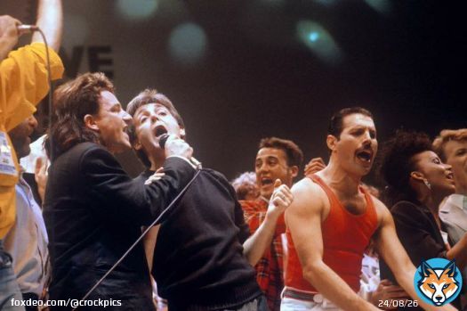 Bono, Paul McCartney, and Freddie Mercury at Live Aid, 1985. Photo by PA Images via Getty Images
