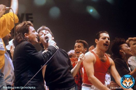 Bono, Paul McCartney, and Freddie Mercury at Live Aid, 1985. Photo by PA Images via Getty Images