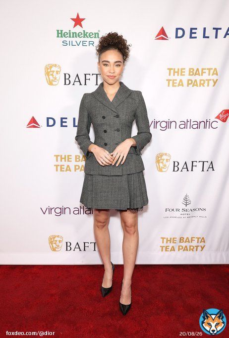 Attending the @BAFTA Tea Party, Bailey Bass wore a grey double-breasted #DiorBarJacket and pleated skirt with lace trim, while Danielle Deadwyler opted for a #DiorSS23 black blouse and skirt with multicolor floral embroidery by Maria Grazia Chiuri. #StarsinDior