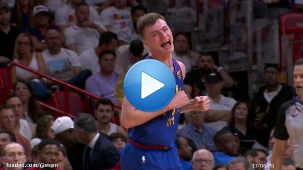 Christian Braun with the TOUGH bucket over Jimmy Butler