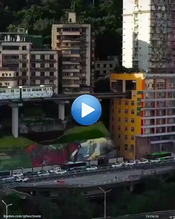 A train that runs through residential apartments in China.