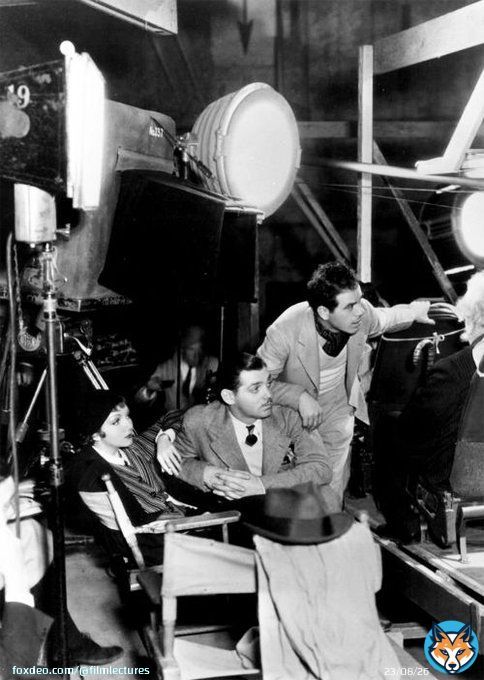 Frank Capra gets ready to shoot the next scene in 1934's 'It Happened One Night' while Claudette Colbert and Clark Gable wait in the wings. After she finished filming, Colbert said to her friends 'I just finished the worst picture in the world.&rdquodquo; She won Best Actress Oscar.