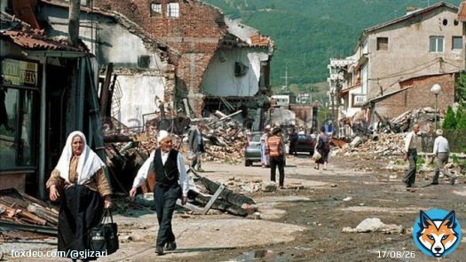 This picture was taken in Kosova. The man with his daughter are both Albanians. Secondly if one cries about the Nato bombings on Serbia (not Yugoslavia) then one should also talk about Serb forces bombing Albanian cities. Or did they have a license to bomb while Nato didn't?