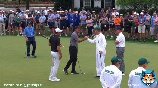 Scottie Scheffler, Ted Scott, and Phil Mickelson greet each other on the practice green.  #TheMasters