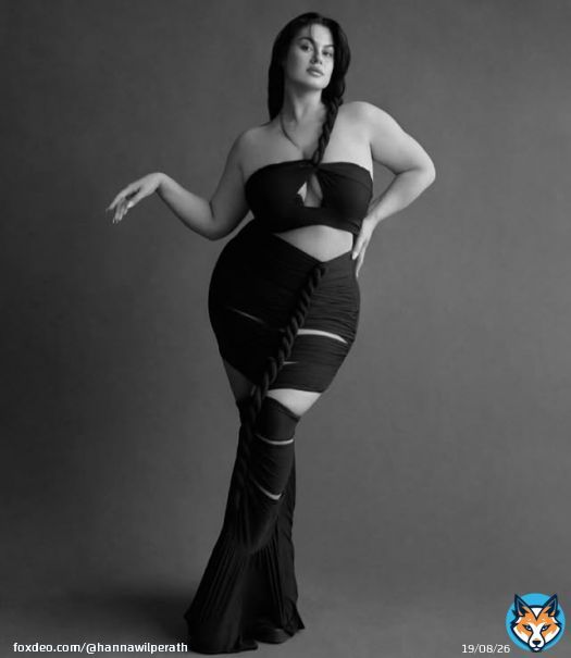 Photo by Hanna Maria on October 22, 2025. May be a black-and-white image of one or more people, make-up, skirt and text.