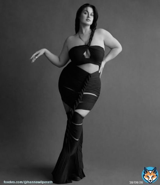 Photo by Hanna Maria on October 22, 2025. May be a black-and-white image of one or more people, make-up, skirt and text.