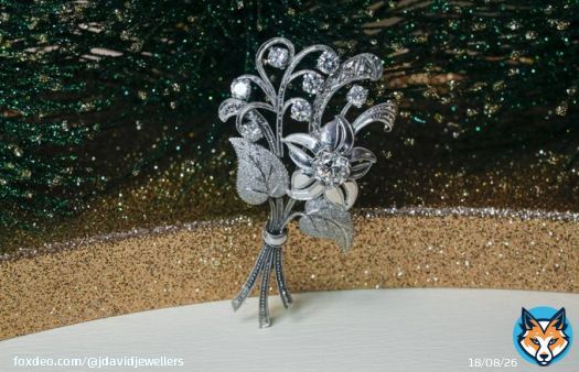 Adding a touch of luxury to the festive season with this exquisite platinum diamond flower brooch - perfect for taking your look from ordinary to extraordinary!  #luxurystyle #diamondsareforever #festiveseason