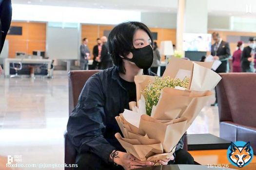 Jungkook holding the bouquet given to him by the hotel on arrival, showing off his shirt infront of the chartered plane, sitting in the stadium. He had such a great time!