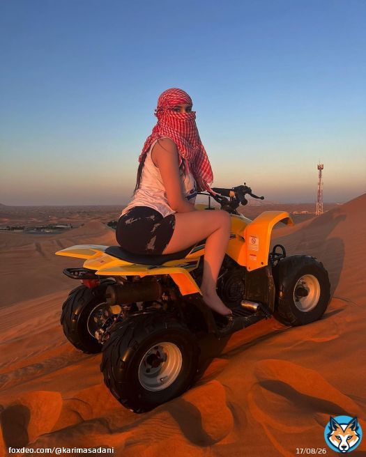Photo by @karimasadani on December 18, 2023. May be an image of 1 person, camel, all-terain vehicle, face mask, headscarf, dune buggy, glasses and outdoors.