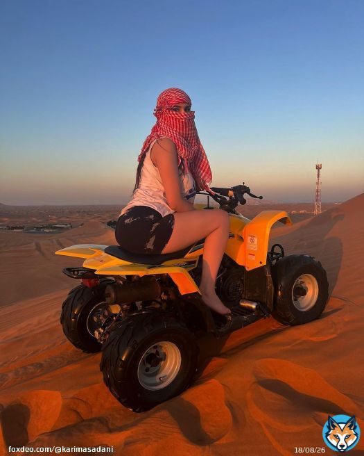 Photo by @karimasadani on December 18, 2023. May be an image of 1 person, camel, all-terain vehicle, face mask, headscarf, dune buggy, glasses and outdoors.