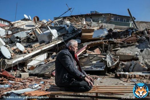 A man prays atop destroyed home in Hatay, Turkiye  - the site of a second 6.4M earthquake yesterday