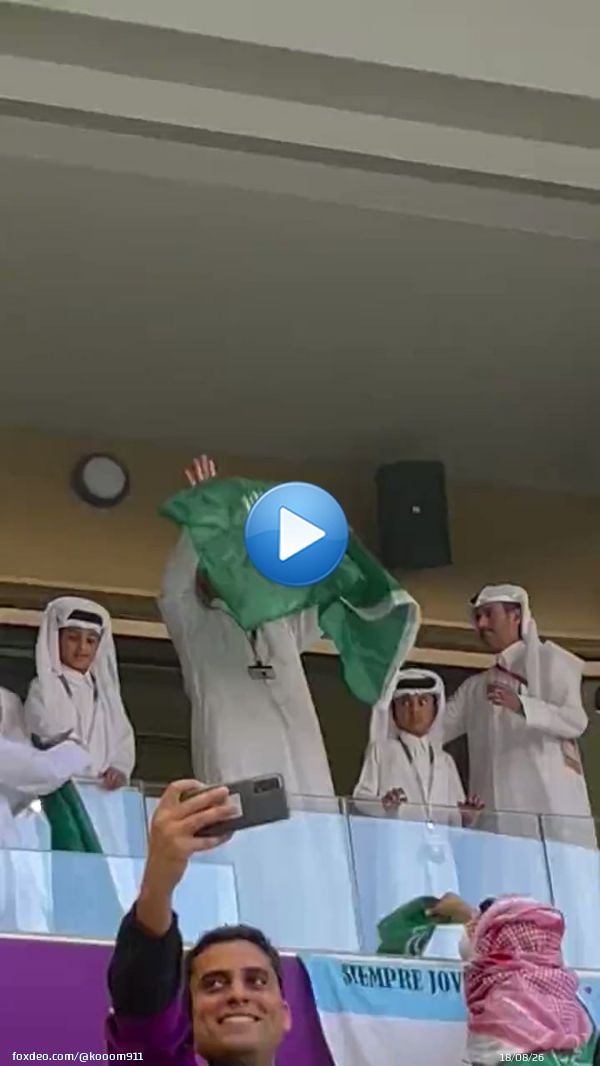 The Emir of Qatar, Sheikh Tamim bin Hamad, wears the flag of the Kingdom of Saudi Arabia during the match between the Saudi national team and Argentina.    #Saudi_Argentina #السعوديه_الارجنتين #أخضرنا_قبل_الكل #المنتخب_السعودي