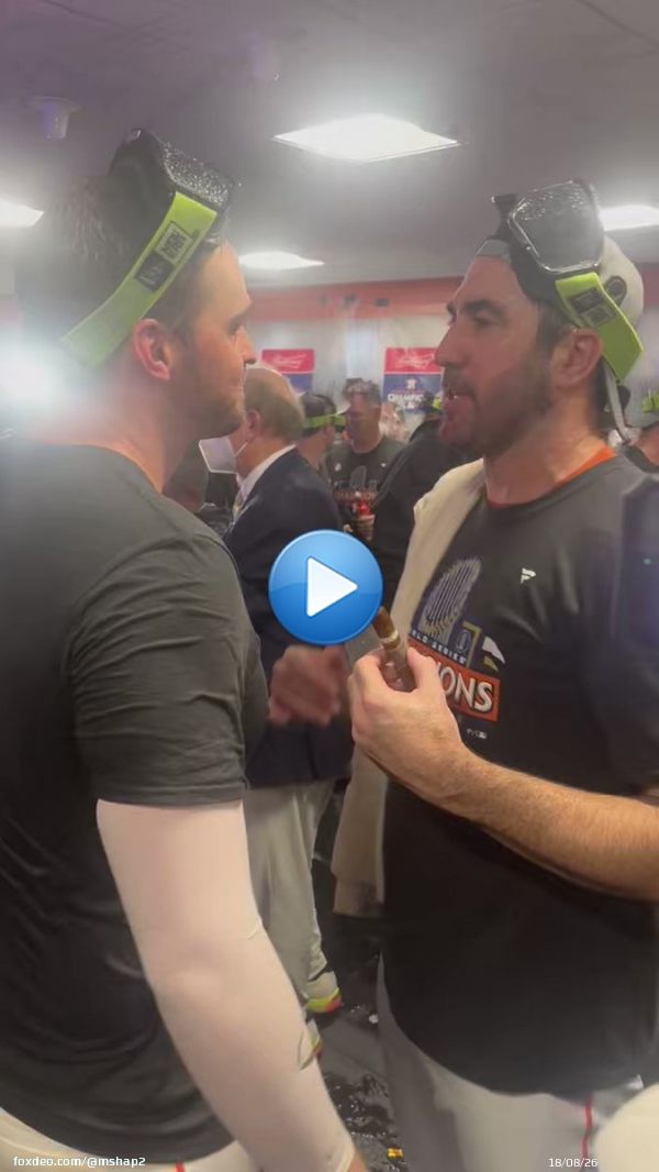 Justin Verlander and Trey Mancini embrace in the locker room.