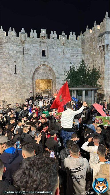Palestinians in Jerusalem celebrate the historic victory of #Morocco over #Portugal in #FIFAWorldCup