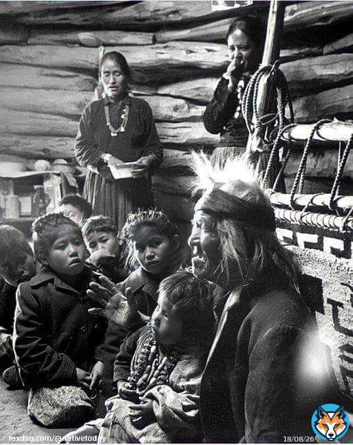Seated close to the evening fire, 91-year old Navajo man, Gray Mountain, tells small children legends about the early days of the Navajo people. 1948. Photographed by, Leonard James McCombe, Photojournalist. (born June 1st, 1923, on the Isle of Man, and who passed away in 2015.)