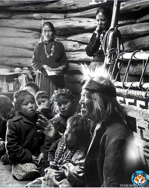 Seated close to the evening fire, 91-year old Navajo man, Gray Mountain, tells small children legends about the early days of the Navajo people. 1948. Photographed by, Leonard James McCombe, Photojournalist. (born June 1st, 1923, on the Isle of Man, and who passed away in 2015.)